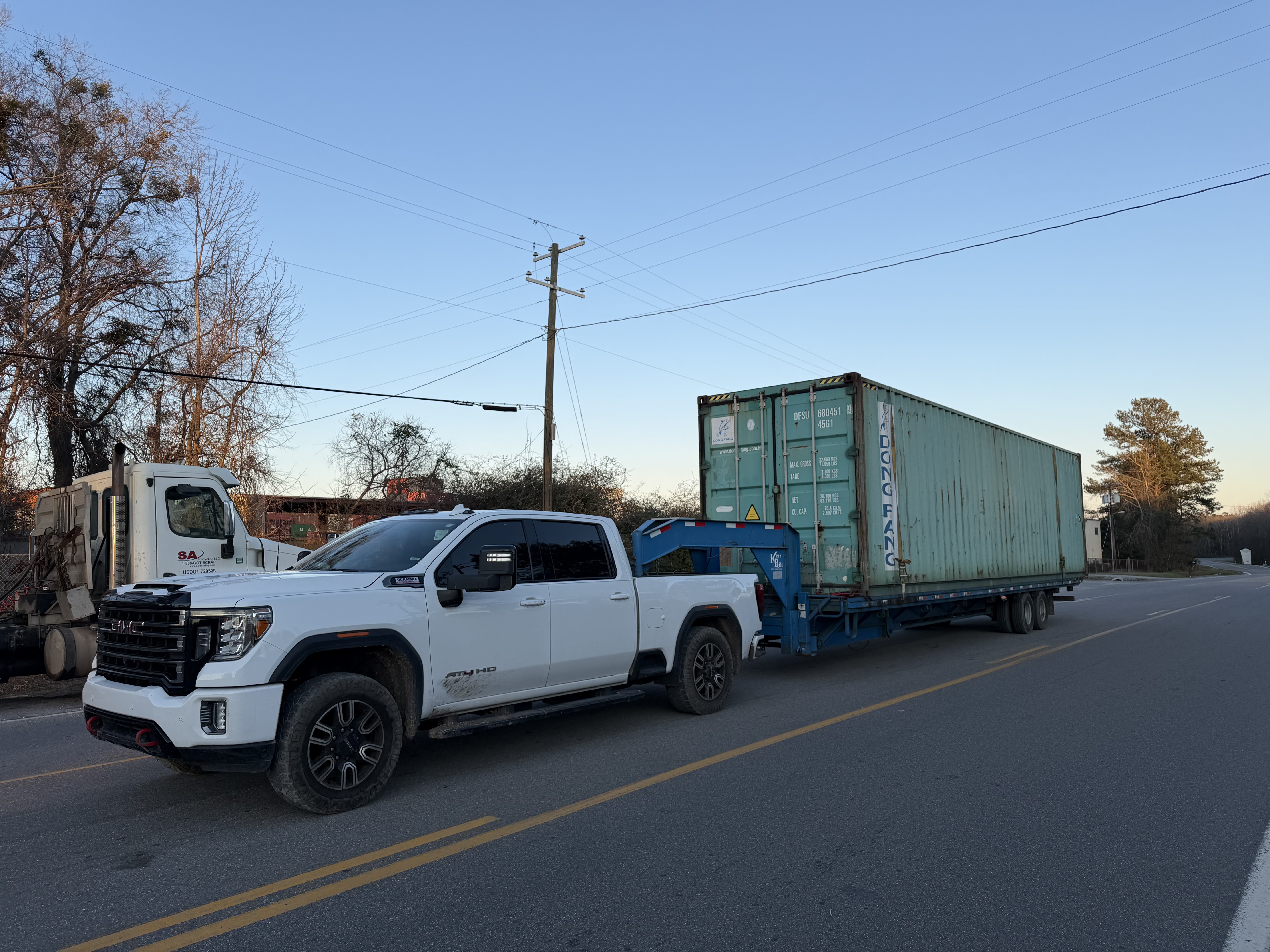 Semper Steel truck hauling a container on delivery