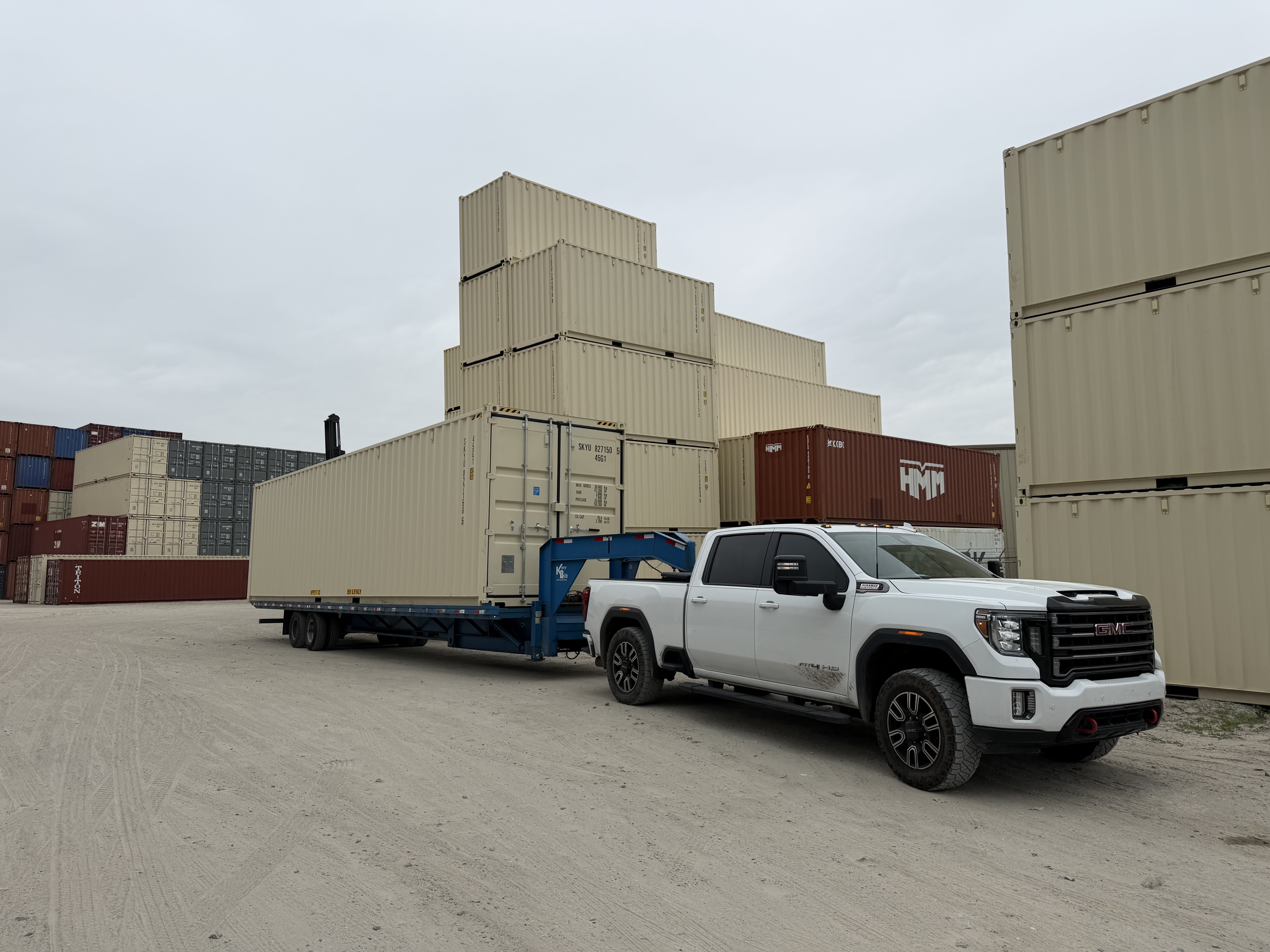 Rows of stacked shipping containers in the Semper Steel yard